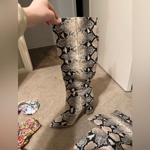 Snakeskin knee high boots